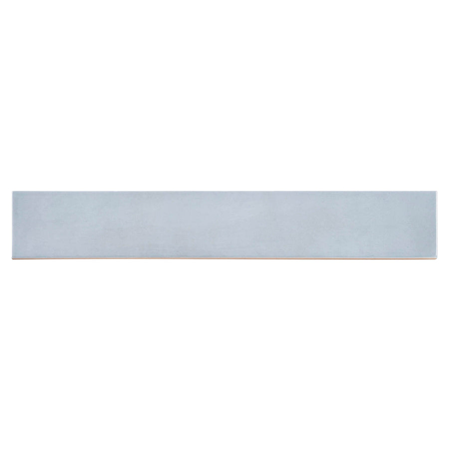 The Manacor 2.5" x 16" Ceramic Tile in Blue Moon is a long, narrow rectangular tile with a smooth matte finish, ideal for contemporary spaces, pictured against a white background.