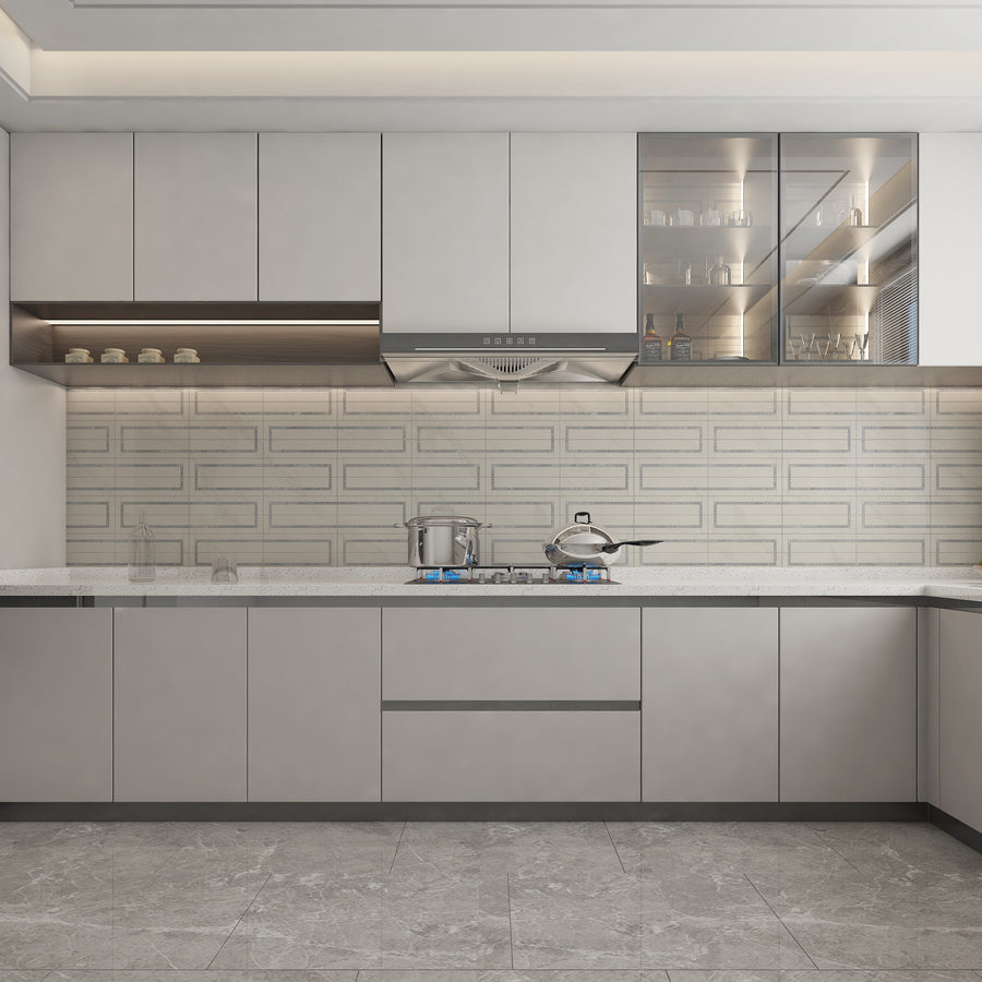 Modern kitchen with sleek, light gray cabinets, a gas stove with pots, glass-fronted upper cabinets displaying dishes and glasses, under-cabinet lighting, and a light patterned backsplash.