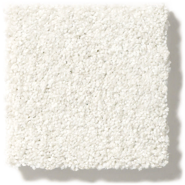 A close-up of Tonal Comfort Blue Family Friendly Carpet shows a white textured square swatch with plush, densely packed fibers for a soft, durable, and comfortable surface ideal for any home.