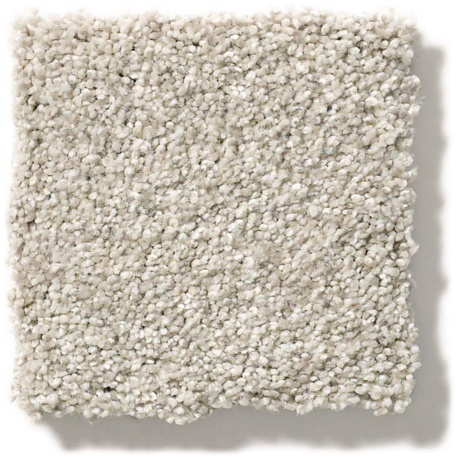 A square sample of Tonal Comfort Blue Family Friendly Carpet in light grey, featuring plush, tightly packed soft fibers and a fluffy, dense texture. Slightly uneven edges make it ideal for cozy living spaces.