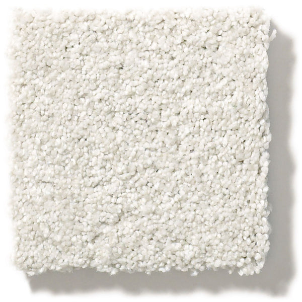 A close-up of a square swatch of Tonal Comfort Blue Family Friendly Carpet, featuring a soft, plush texture and white appearance, set against a plain white background.