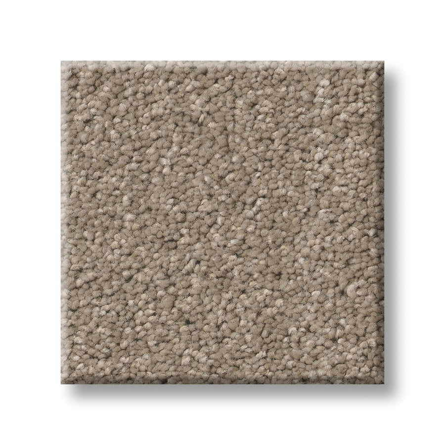 A square sample of Serene Stria Family Friendly Carpet in light brown with a soft, plush texture is displayed against a white background—an inviting, durable choice ideal for active households.
