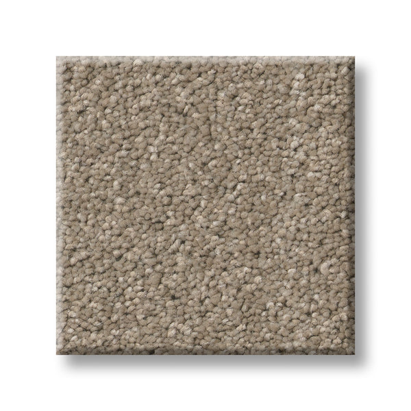 A square sample of Serene Stria Family Friendly Carpet in light brown with a soft, plush texture is displayed against a white background—an inviting, durable choice ideal for active households.