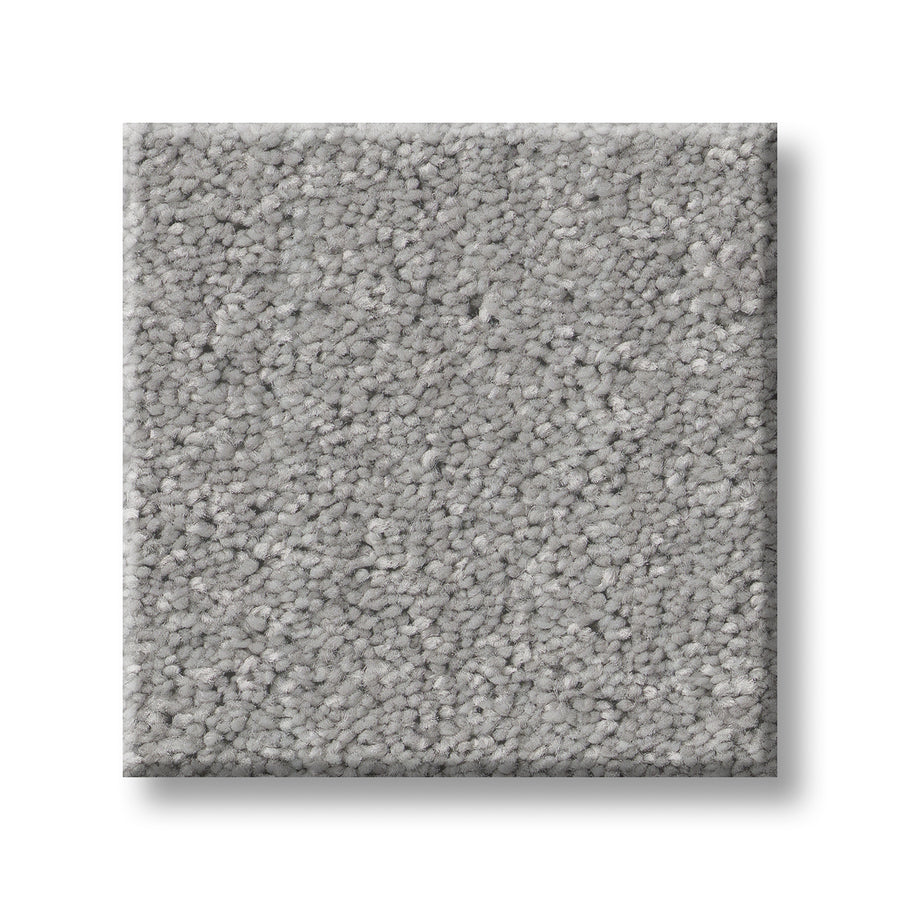 The Serene Stria Family Friendly Carpet sample features a light gray, square, plush, and textured surface. Durable and soft, it's perfect for any space. Displayed against a white background.