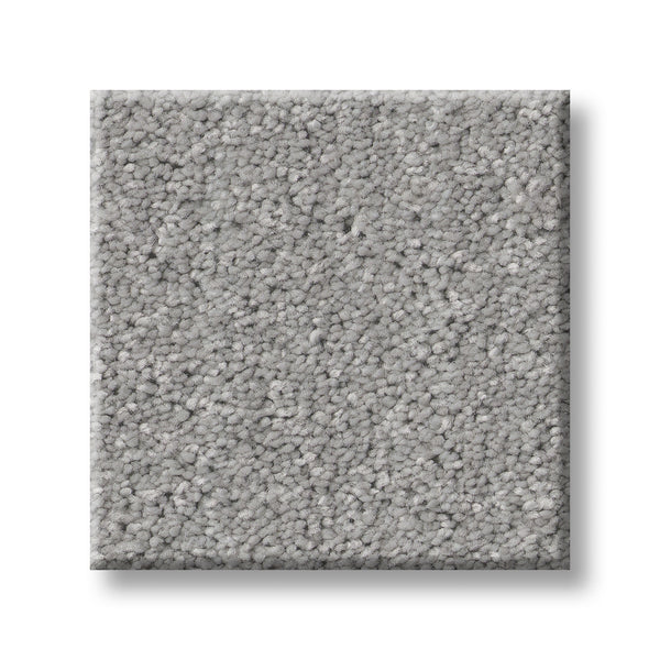 The Serene Stria Family Friendly Carpet sample features a light gray, square, plush, and textured surface. Durable and soft, it's perfect for any space. Displayed against a white background.