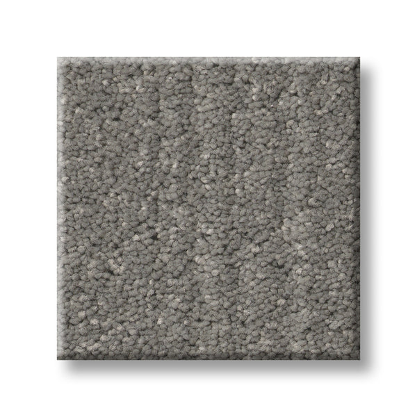A square sample of Serene Stria Family Friendly Carpet in medium-pile, light gray with a soft, textured surface is shown on a white background.