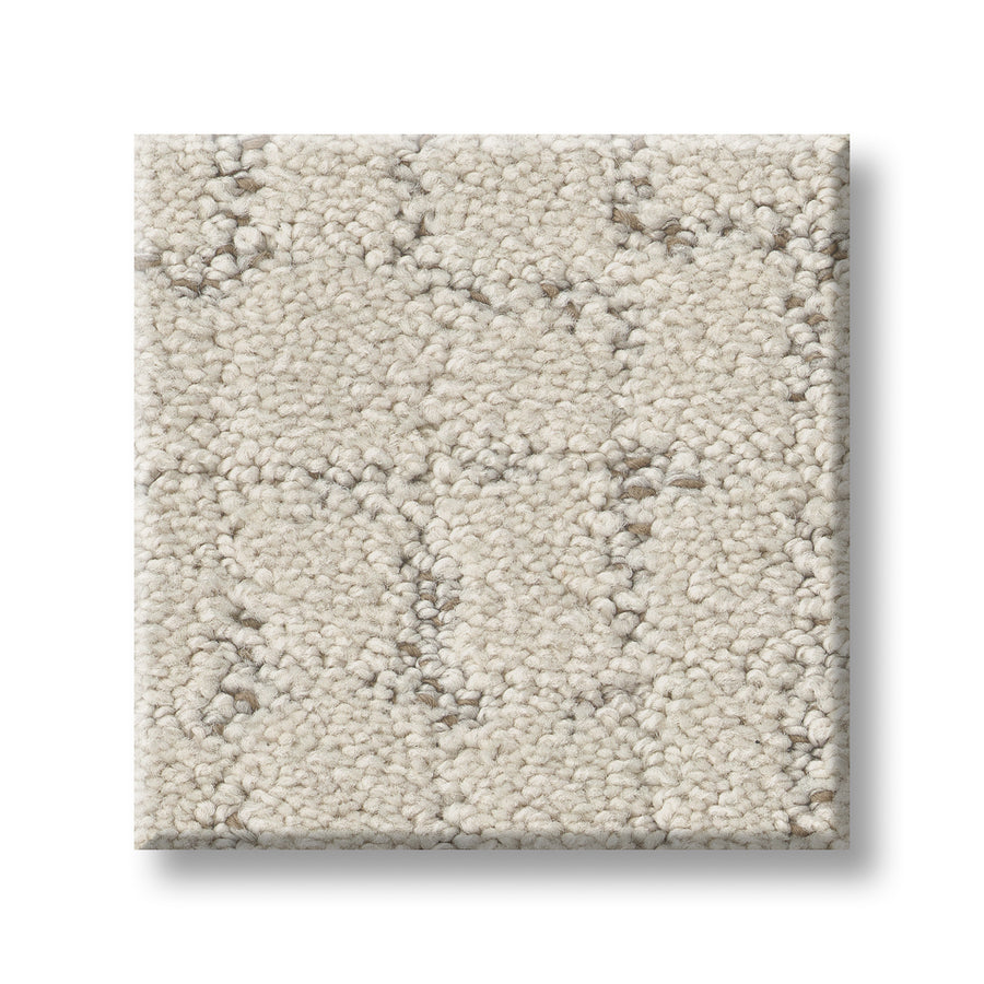 This Block Party Family Friendly Carpet sample is a square, light beige swatch with a textured loop pile and subtle geometric pattern, displayed on a white background.