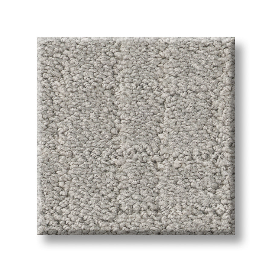 A sample square of Block Party Family Friendly Carpet, featuring elegant light gray textured stripes, is shown on a white background—a stylish and practical flooring choice.