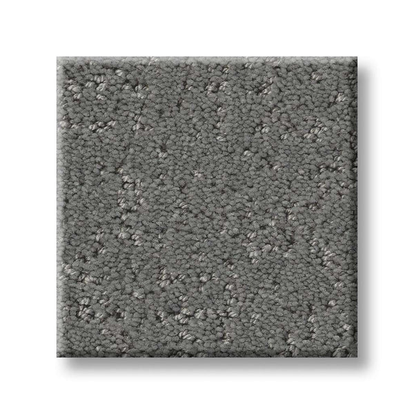 A square sample of Canvas Comfort Blue Family Friendly carpet in grey with a slightly speckled texture is displayed on a white background.