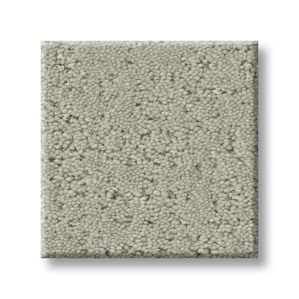A square sample of Canvas Comfort Blue Family Friendly light gray, textured loop pile premium carpet is displayed on a white background.