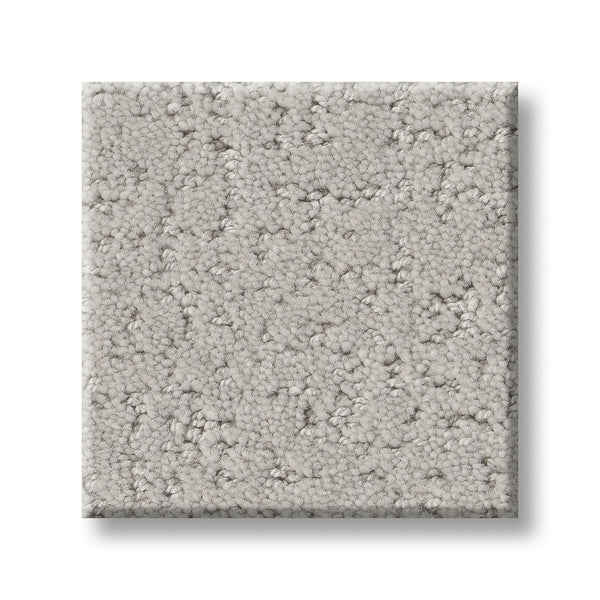 A square sample of Canvas Comfort Blue Family Friendly carpet, featuring a light gray loop pile texture, is displayed against a white background.