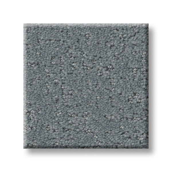 A square swatch of Canvas Comfort Blue Family Friendly carpet, featuring a premium, medium gray tone with a textured, slightly mottled look, displayed on a white background.