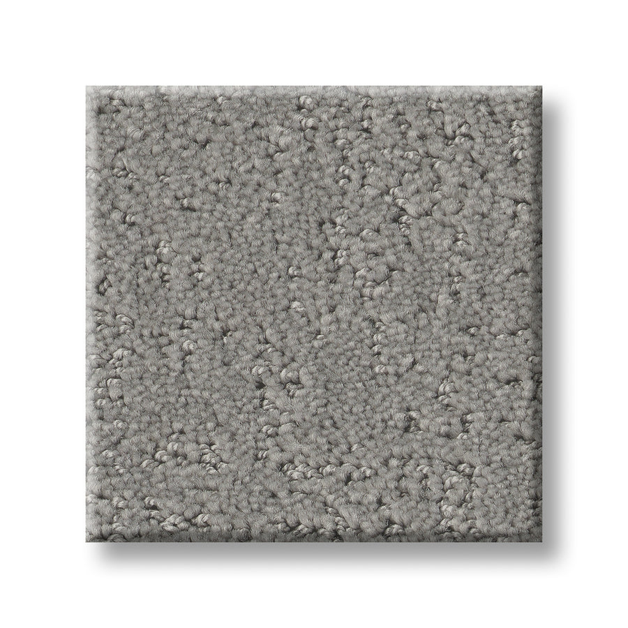 A square swatch of Canvas Comfort Blue Family Friendly carpet, featuring light gray, textured short loops, is displayed against a white background to highlight its stylish and durable design.