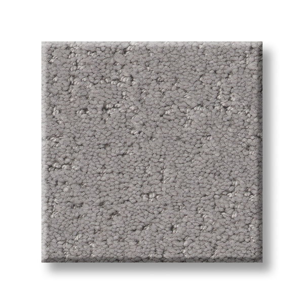 A sample square of Canvas Comfort Blue Family Friendly carpet, featuring a light gray color, premium soft and dense texture, and a uniform, lightly speckled pattern shown on a white background.