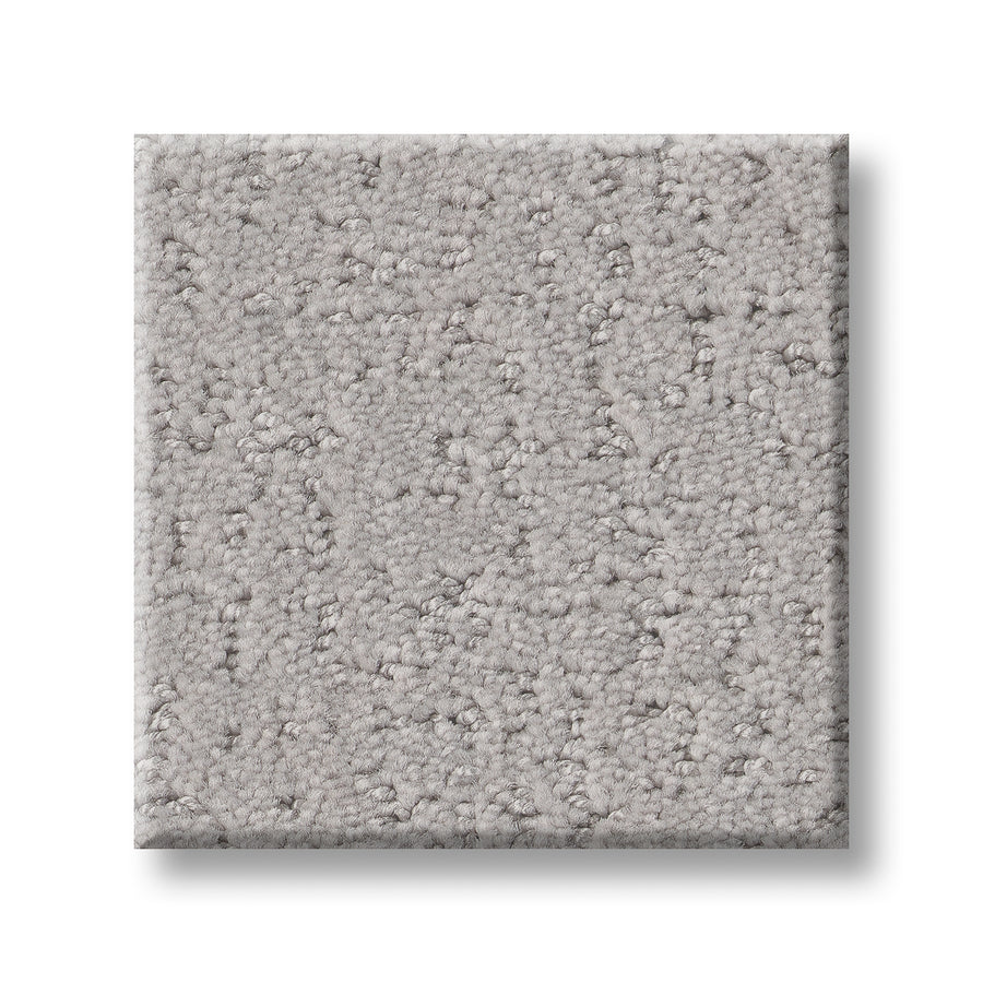 A square sample of Canvas Comfort Blue Family Friendly carpet, light gray with a soft, looped texture, is shown against a white background.