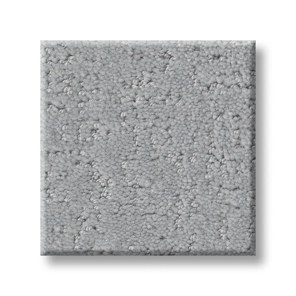 A sample of Canvas Comfort Blue Family Friendly, a luxurious light gray carpet with a subtle, irregular texture, is displayed on a white background.