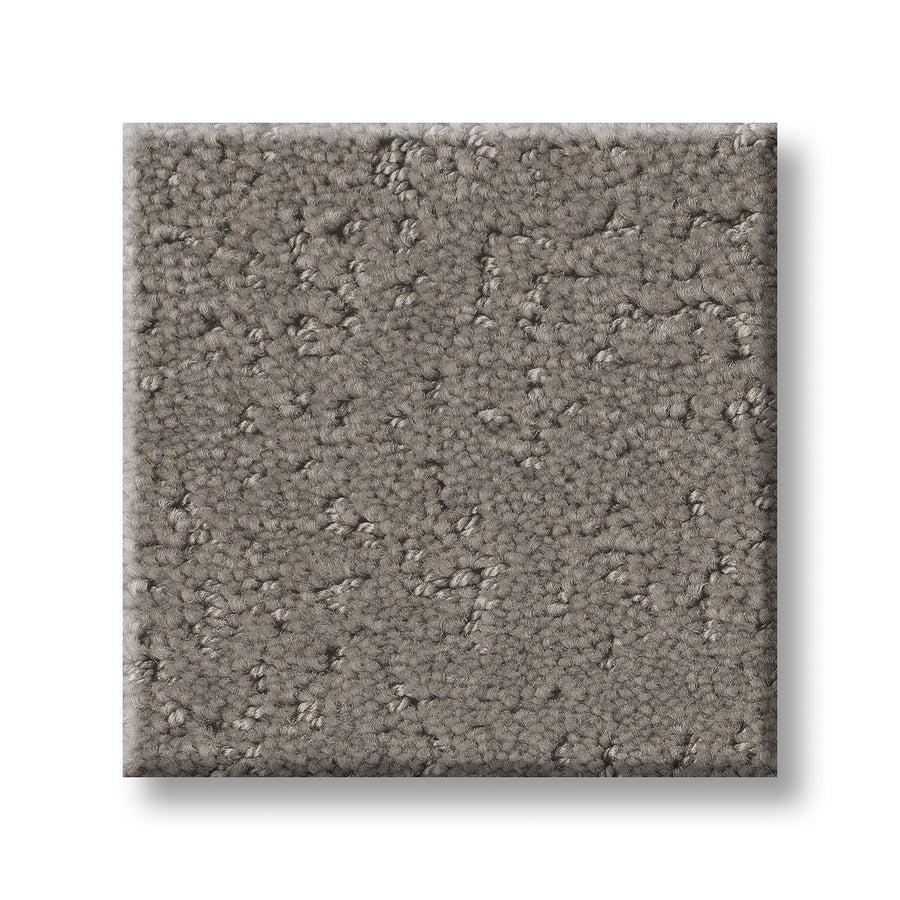 A square sample of Canvas Comfort Blue Family Friendly carpet, featuring a soft, looped pile and taupe-gray textured surface, is displayed on a white background.