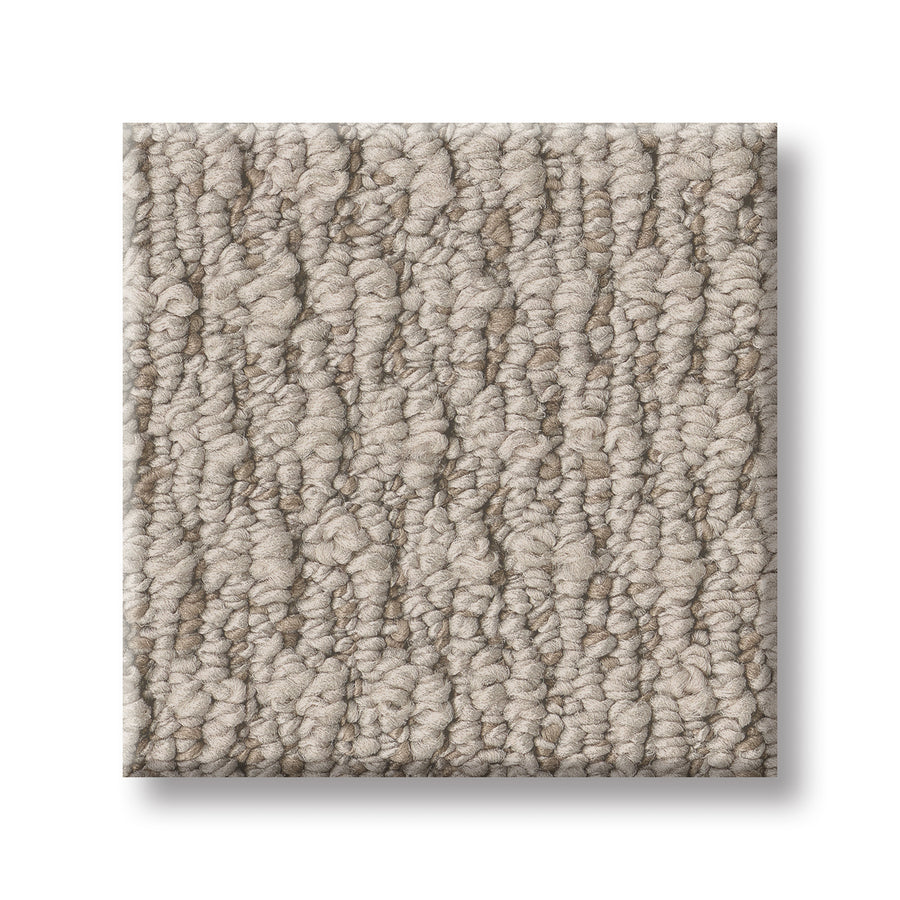 A square sample of Cozy Embrace Pet Friendly Carpet, featuring a luxurious textured beige loop with a gently wavy raised pattern for comfort and style—displayed on a white background.