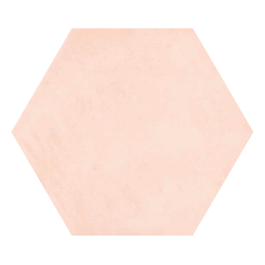 A Martha's Manor 4" x 5" Hexagon Ceramic Tile in Provence Rose, featuring a smooth texture and pale pink color, is centered on a white background.