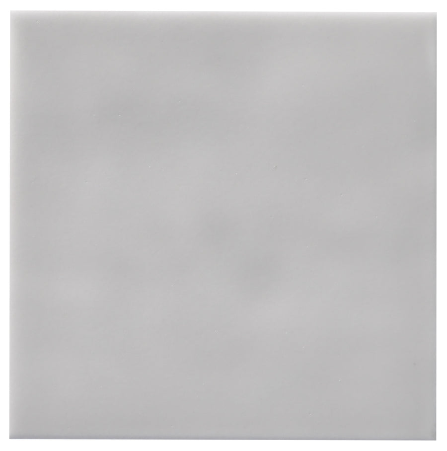 The Zephyr 4x4 Ceramic Tile is a smooth, light gray tile with subtle shading and no visible patterns, available by special order to complement Mediterranean-inspired spaces.