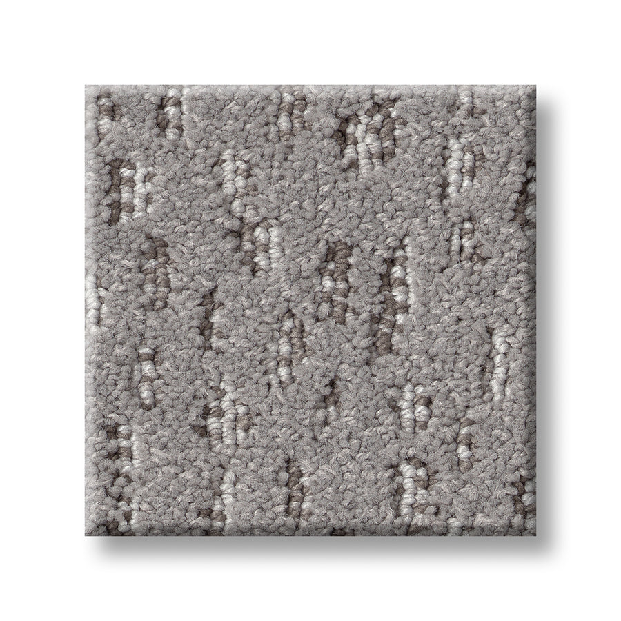 A square sample of Ambitious On Trend Carpet in light gray with a textured surface and subtle, uneven dotted and dashed darker gray patterns, shown on a white background.
