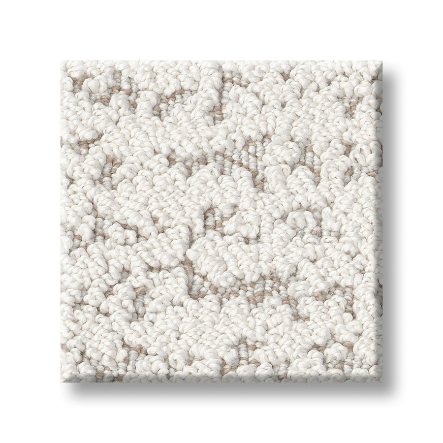 A square sample of Tangent On Trend Carpet in light beige, featuring a looped pile pattern and shown on a white background, displays a stylish design ideal for modern interiors.