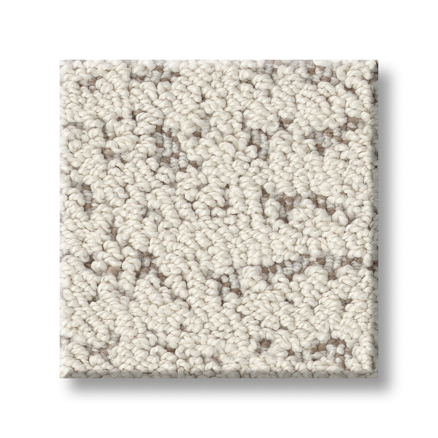 A square swatch of Tangent On Trend Carpet in light beige, with a loop-pile texture and subtle brown and gray flecks. This carpet offers a soft, dense look and modern style, perfect for contemporary spaces.