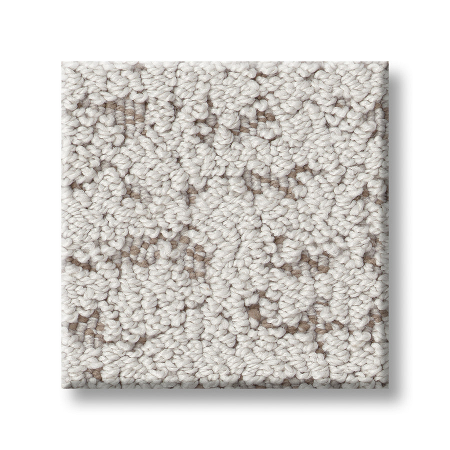 A square swatch of Tangent On Trend Carpet in light beige, showcasing tightly looped fibers and a textured finish, is displayed on a white background for a modern, trendy look.