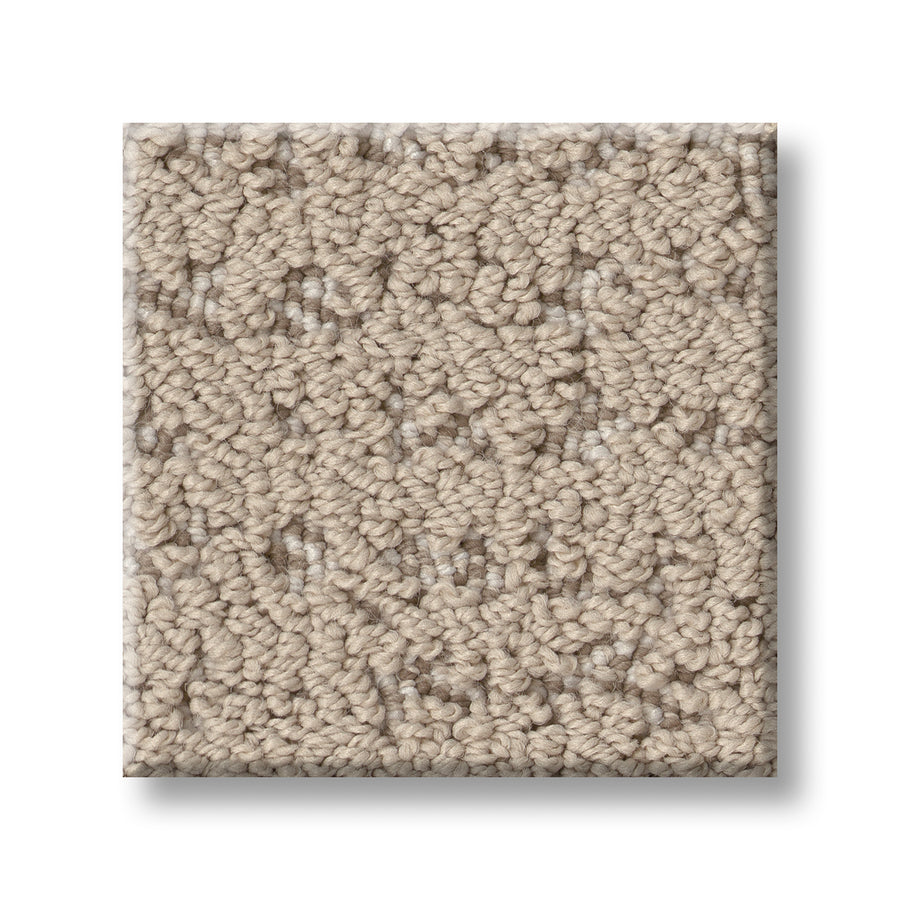 A square sample of Tangent On Trend Carpet in beige, featuring a textured loop and subtle, irregular pattern, is displayed against a white background.