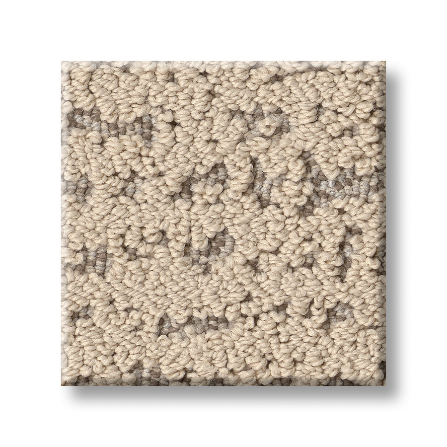 A square swatch of Tangent On Trend Carpet is shown from above on a white background, displaying a textured beige surface with a subtle, irregular light and dark beige pattern for an on-trend look.