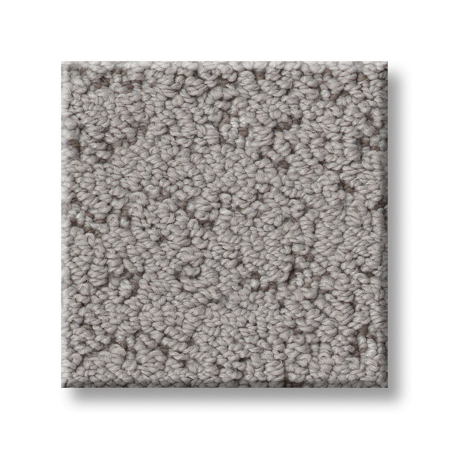 A close-up of Tangent On Trend Carpet in light gray highlights its soft, dense surface and textured loop design, creating a luxurious, stylish look against a white background.
