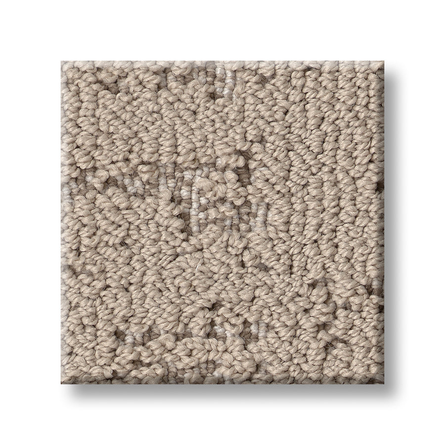 A close-up of Discover On Trend Carpet, featuring a square swatch of beige textured, looped pile design that highlights its luxury and contemporary pattern against a plain white background.
