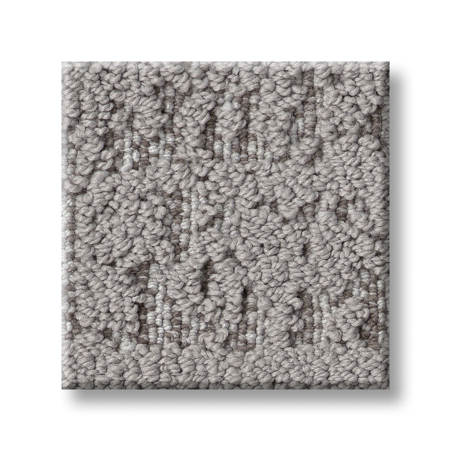 A close-up of Discover On Trend Carpet, featuring a textured, light gray surface with subtle geometric patterns and a modern look, shown on a white background.