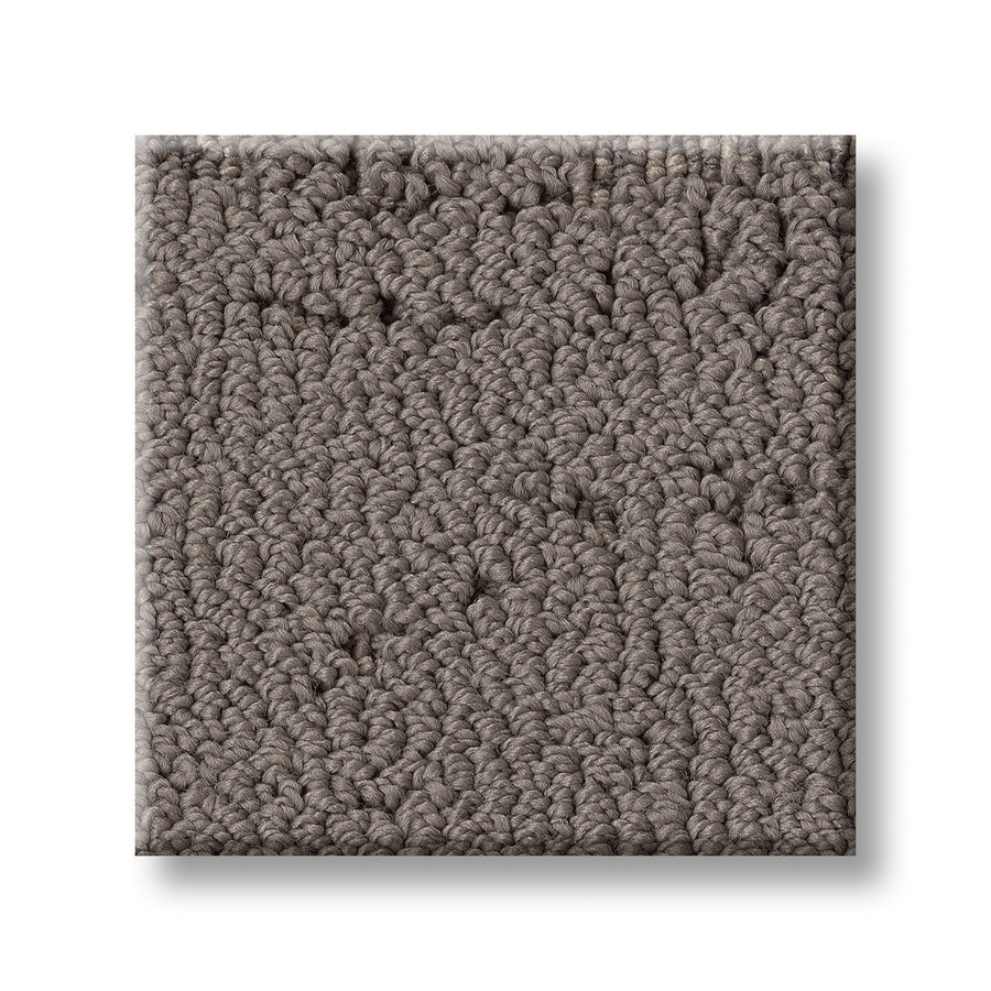 A square sample of Discover On Trend Carpet, a textured, loop-pile style in solid taupe gray, shown on a white background. Its dense, tightly packed loops create a luxurious look ideal for modern and contemporary spaces.