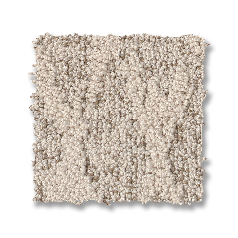 The Illumination On Trend Carpet is a square sample of light beige, looped textured carpet, shown on a white background—perfect for adding stylish comfort to any space.