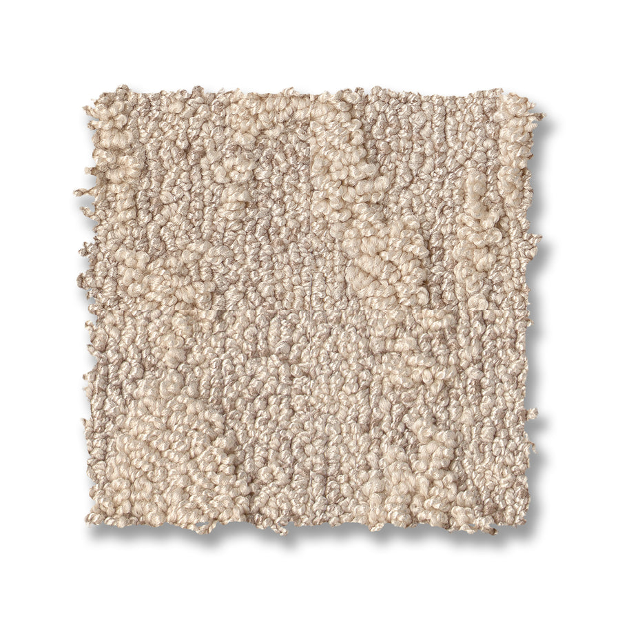 A square swatch of Illumination On Trend Carpet in light beige displays a blend of looped and cut fibers, offering a soft, plush texture and elegant look—ideal for luxurious flooring accents.