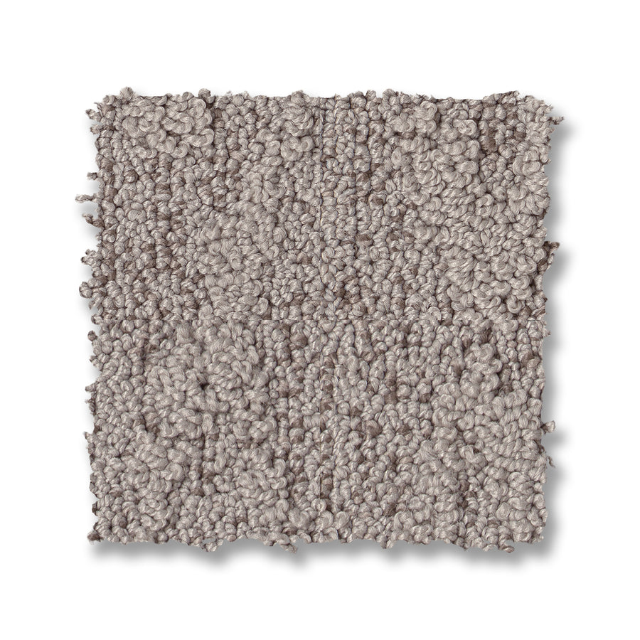 A square sample of Illumination On Trend Carpet in light gray, featuring a textured loop and plush look, is displayed on a white background—ideal for anyone wanting luxurious, stylish flooring.