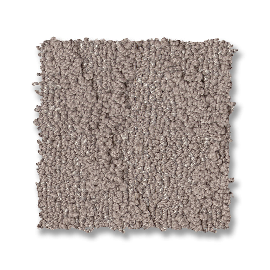 A square sample of Illumination On Trend Carpet, featuring premium textured loop-pile in light taupe, displayed on a white background.