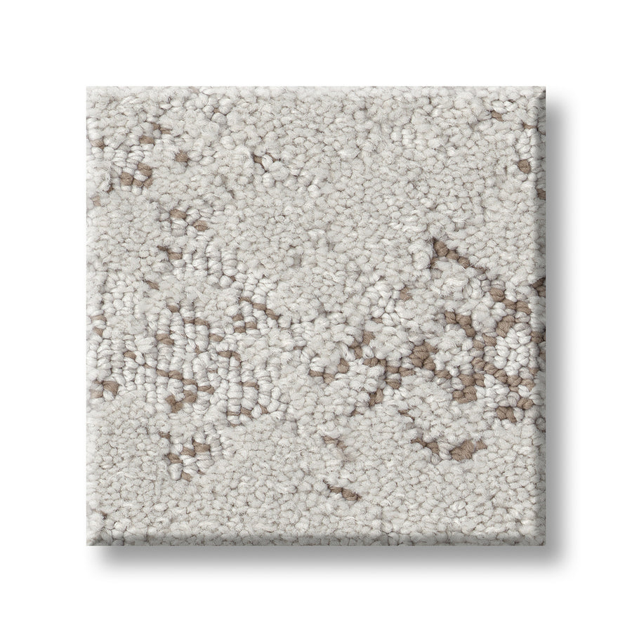 A square sample of Evoke On Trend Carpet displays a textured loop pattern in light beige and cream, with subtle brown hints, arranged on a white background.