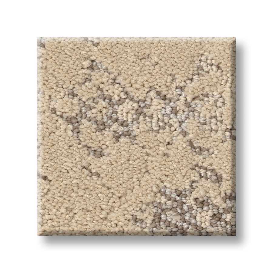 A square sample of Evoke On Trend Carpet in beige, showcasing a subtle abstract geometric pattern in light and dark taupe—a luxurious floor covering displayed on a white background.