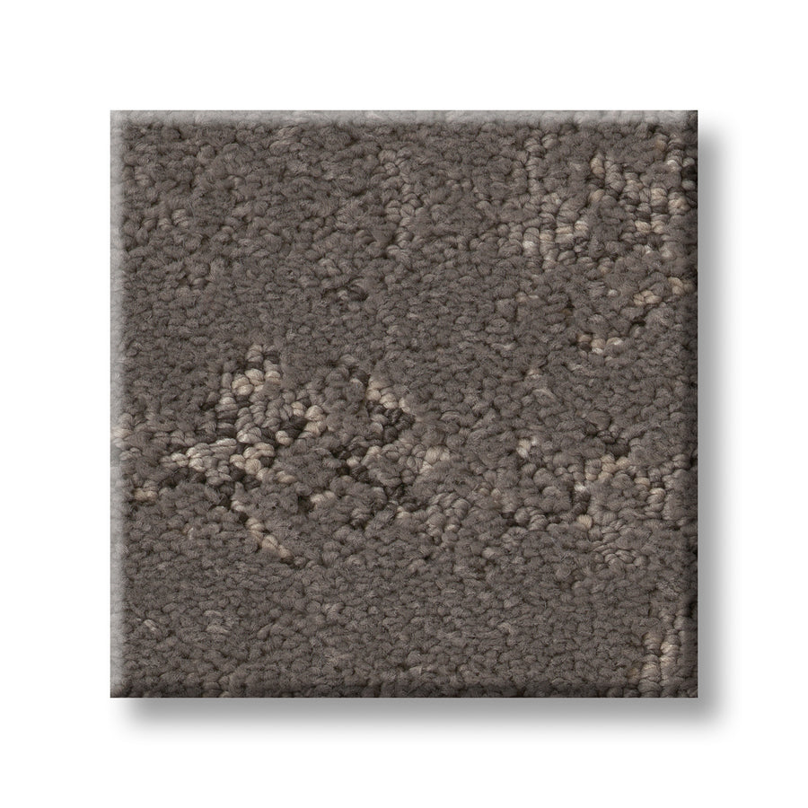 A square swatch of Evoke On Trend Carpet in textured brown, featuring a subtle raised geometric pattern and mottled look, shown on a white background—a stylish, contemporary flooring choice.
