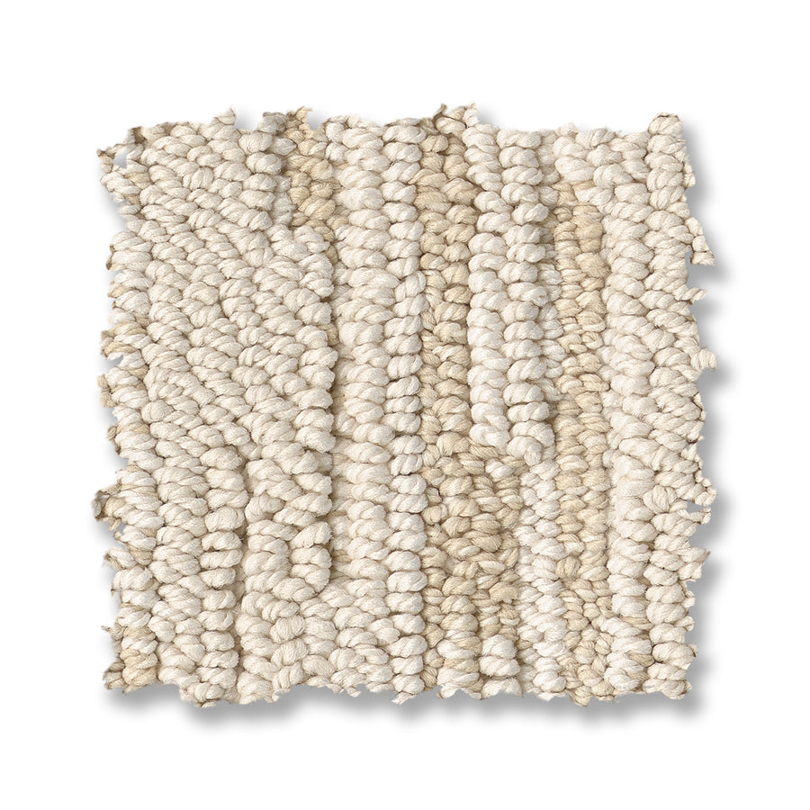 A sample of Loom Berber Carpet in cream shows off thick, chunky yarns and visible vertical rows on a white background, adding a sophisticated touch to any space.