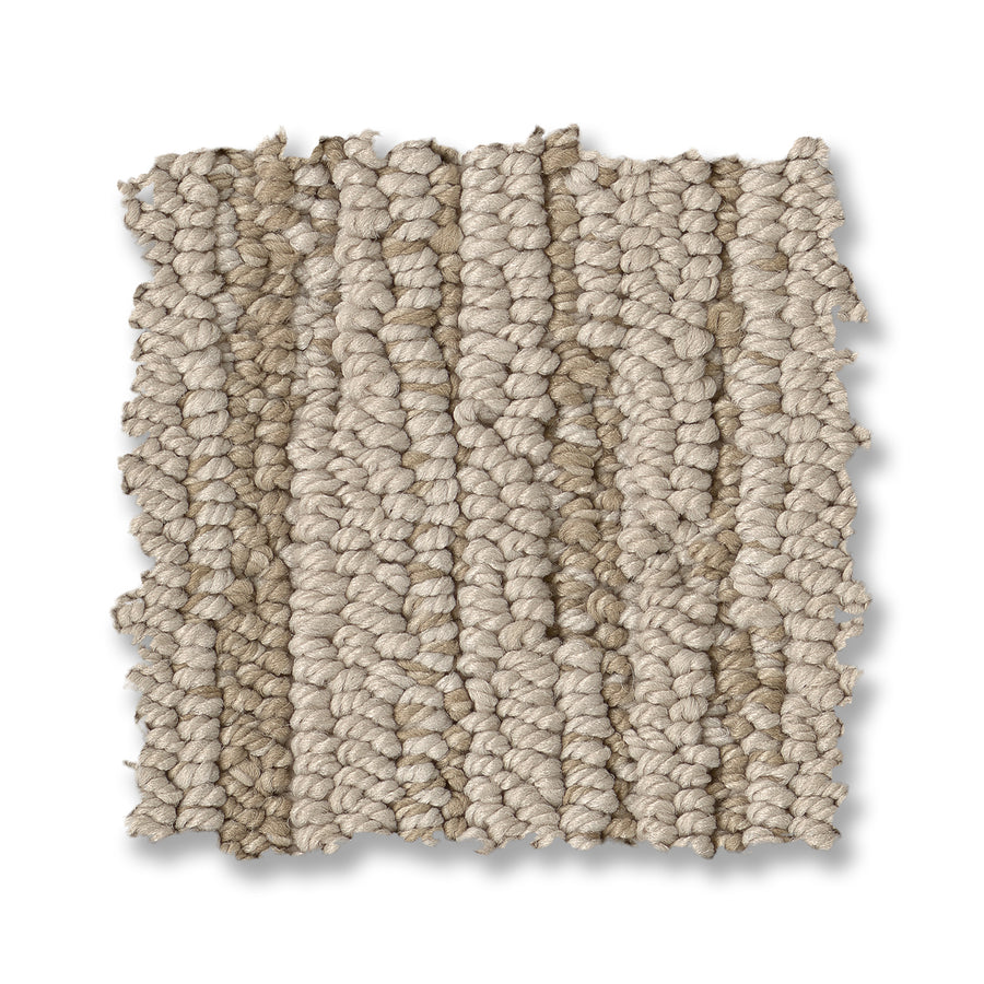 A square sample of Loom Berber Carpet shown on a white background, showcasing its thick, chunky yarn loops in a light beige hue for a refined look.