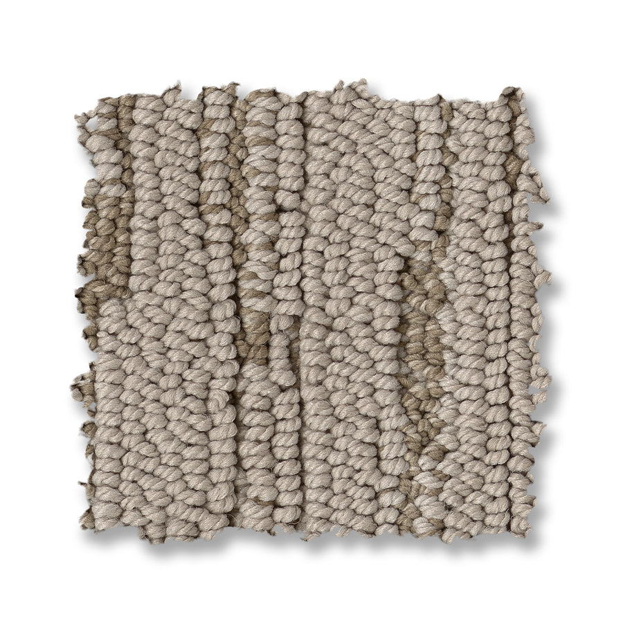 A textured beige square swatch of Loom Berber Carpet, with visible rows and uneven edges, displays a sophisticated look against a white background.