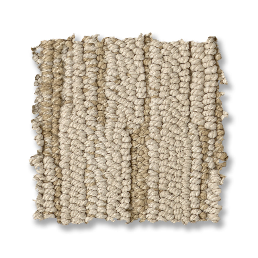 A swatch of Loom Berber Carpet with textured, looped beige fibers and a chunky feel is shown on a white background—ideal for enhancing any space with sophistication.