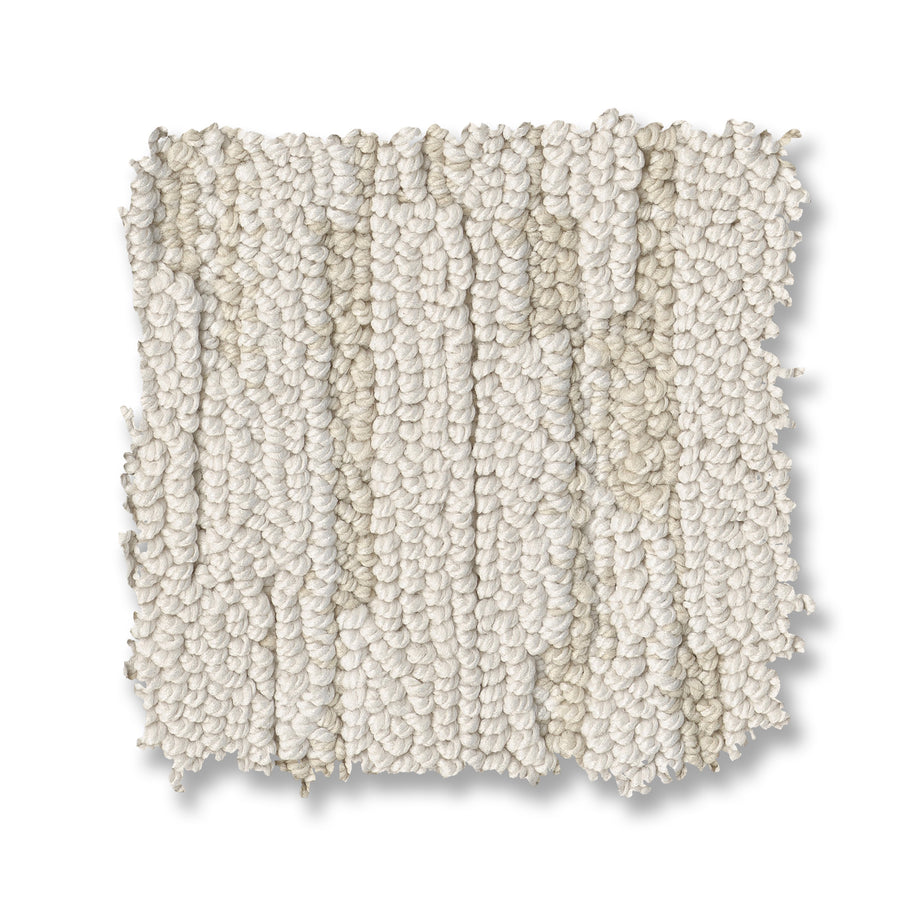 A square swatch of Loom Berber Carpet, featuring textured looped fibers in off-white, is shown on a white background. Subtle tonal and thickness variations create a soft, plush appearance for an elegant look.