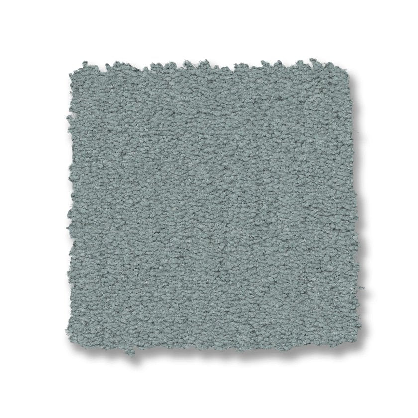 A square swatch of Finery Pet Friendly Carpet, featuring durable looped fibers in a muted blue-gray shade, displayed against a white background.