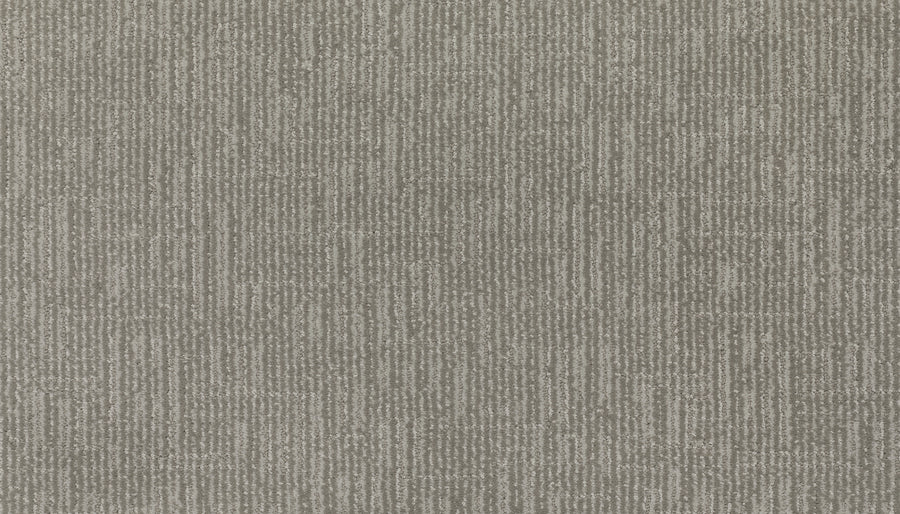 Close-up of Magnetic Vision Family Friendly Carpet in Breathless, featuring a textured gray surface with subtle intersecting lines and rectangles for a modern look—ideal as a durable option for family spaces.
