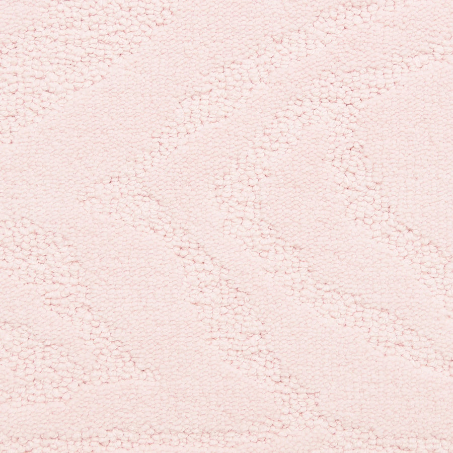 Close-up of Capetown On Trend Carpet in Malay, a soft, pale pink fabric with a subtle wavy zigzag pattern. This plush material is perfect for cozy blankets or adding comfort and style to high-traffic spaces.