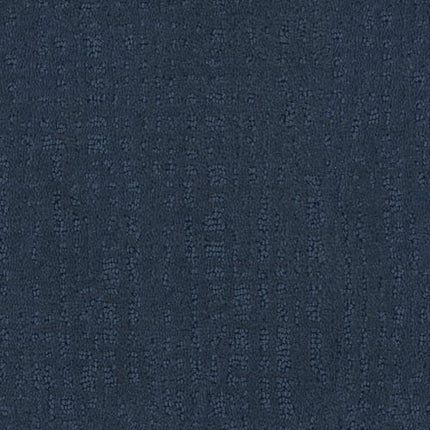 Homage Berber Carpet in Mandalay features dark blue textured fabric with a subtle, irregular dotted vertical pattern. Its soft feel and understated design make it ideal for sophisticated, modern high-traffic spaces.